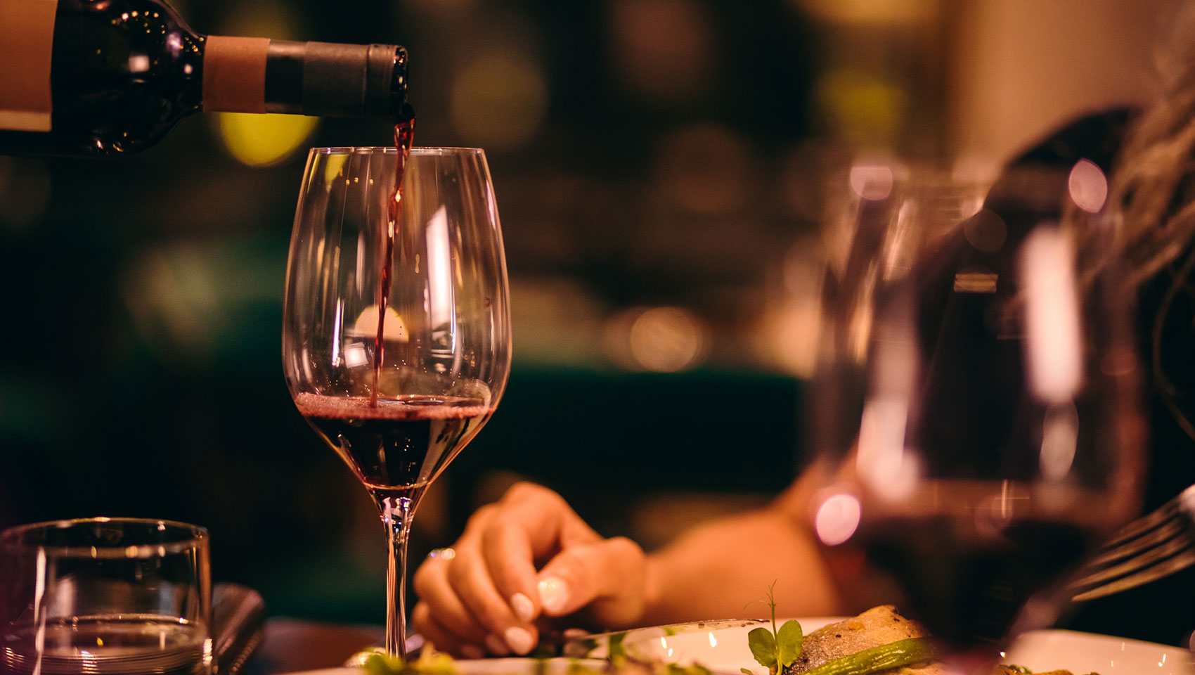 wine being poured in glass